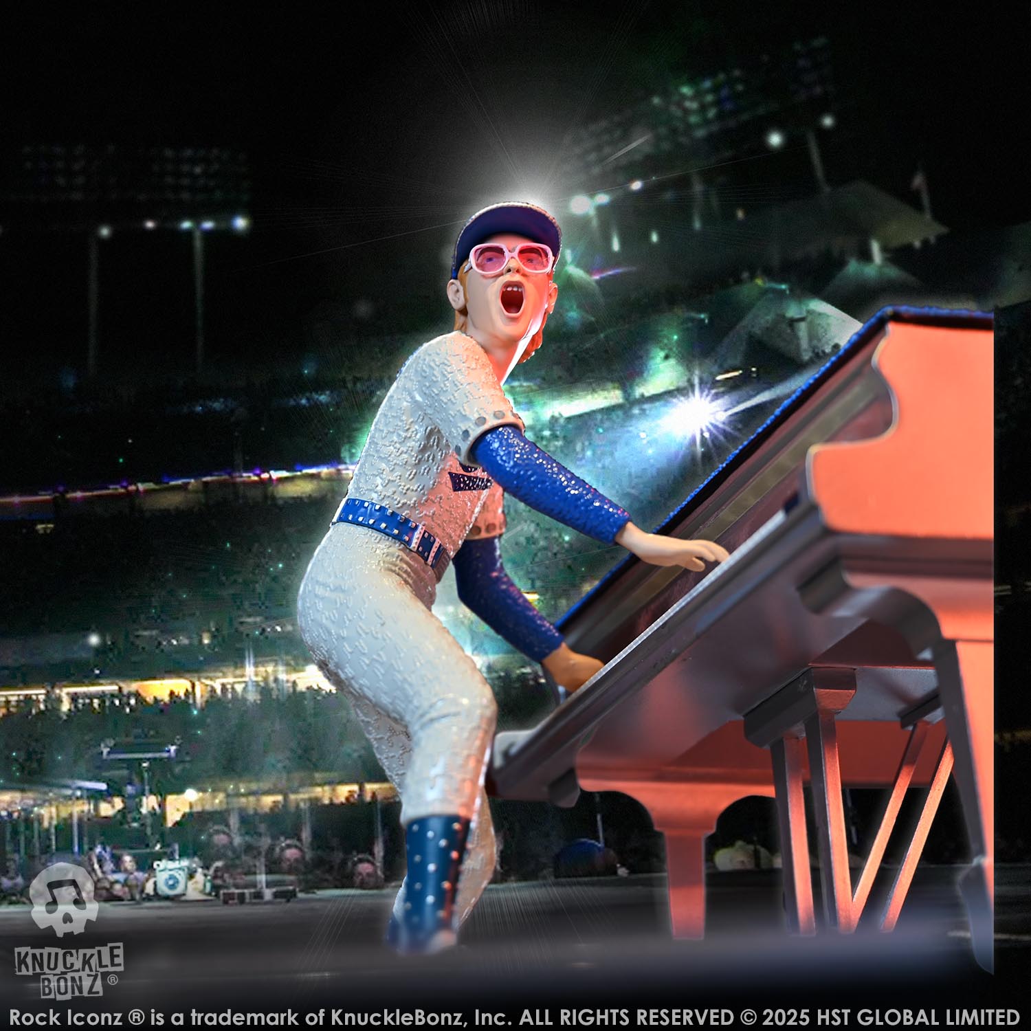 Statue of Elton John with a grand piano in a baseball uniform with a stadium background