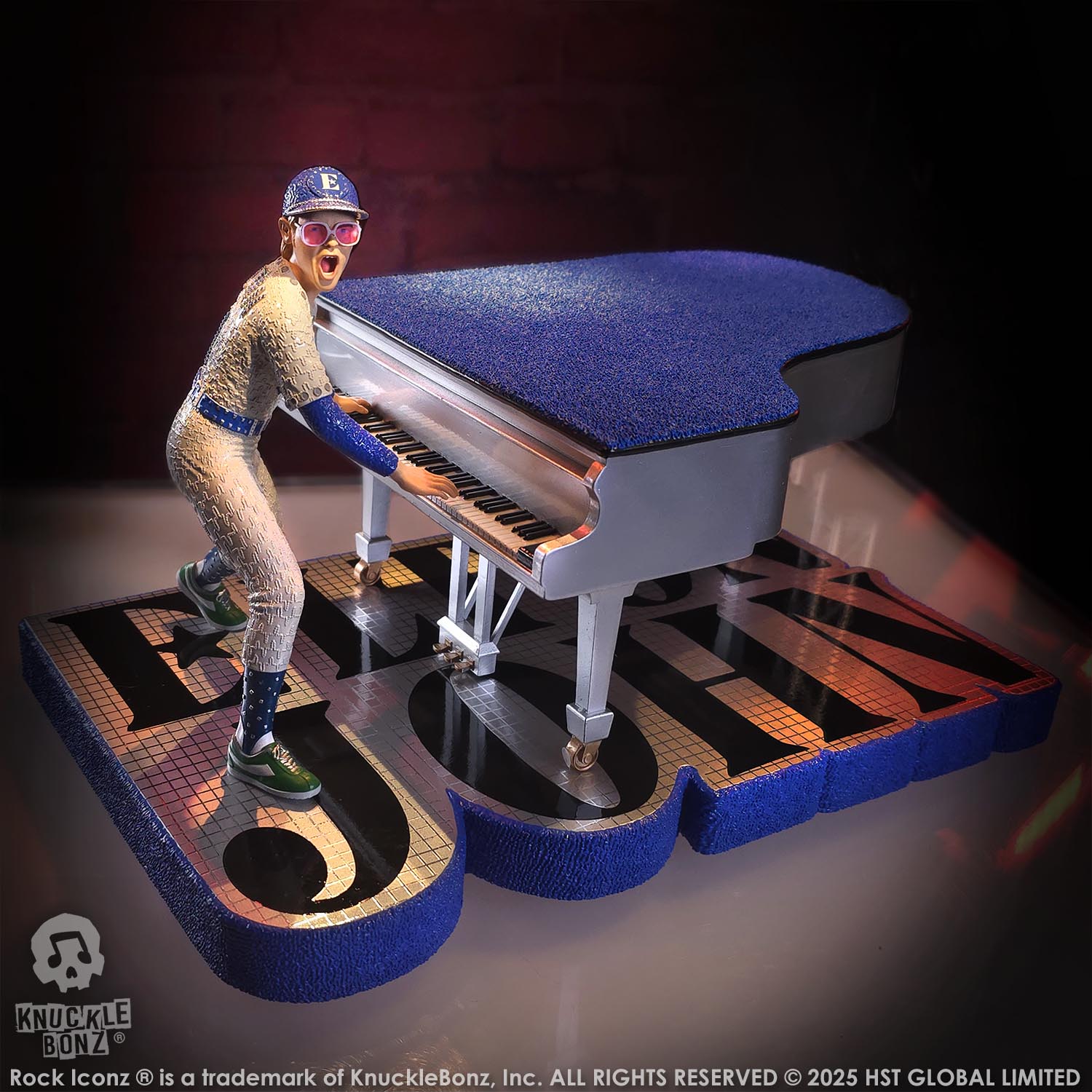 Statue of Elton John with a grand piano in a baseball uniform with a red background