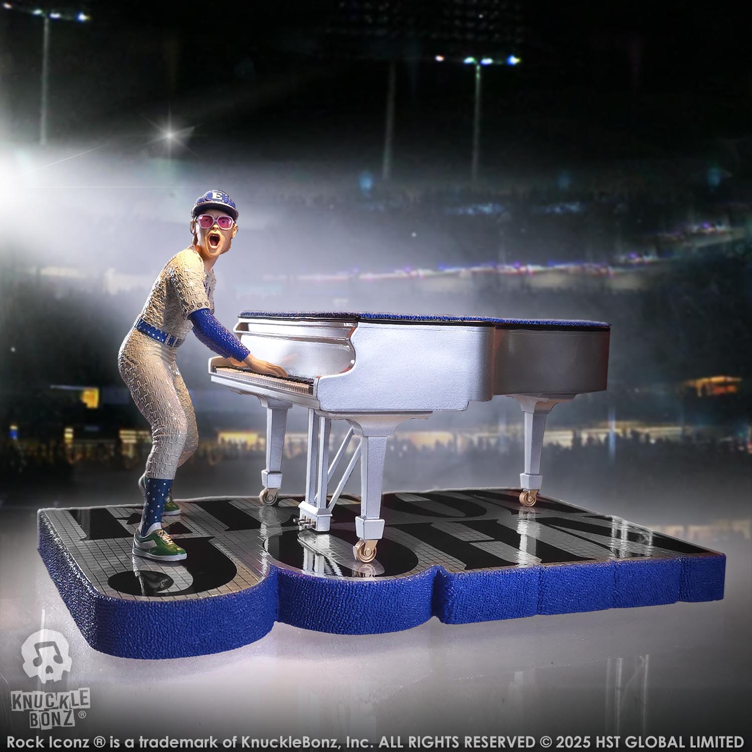 Statue of Elton John with a grand piano in a baseball uniform and stadium background
