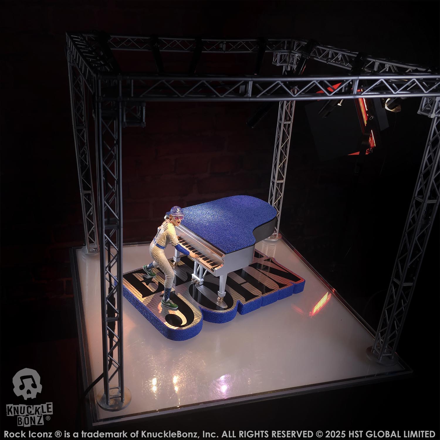 Statue of Elton John with a grand piano in a baseball uniform with a dark background