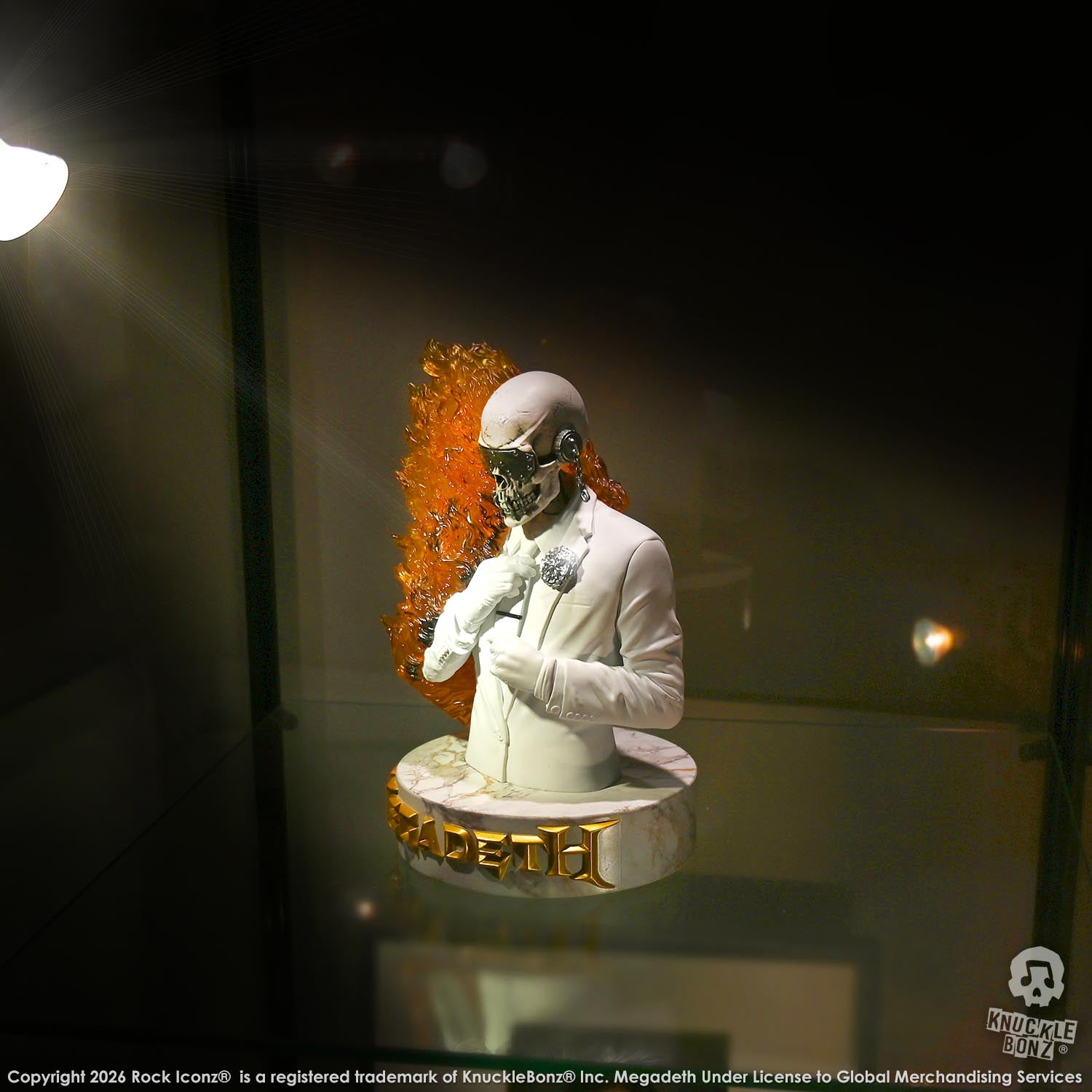 Limited edition statue of a skeleton in a white suit with red and orange flames. The statue s part of the 3D Vinyl KnuckleBonz collection.