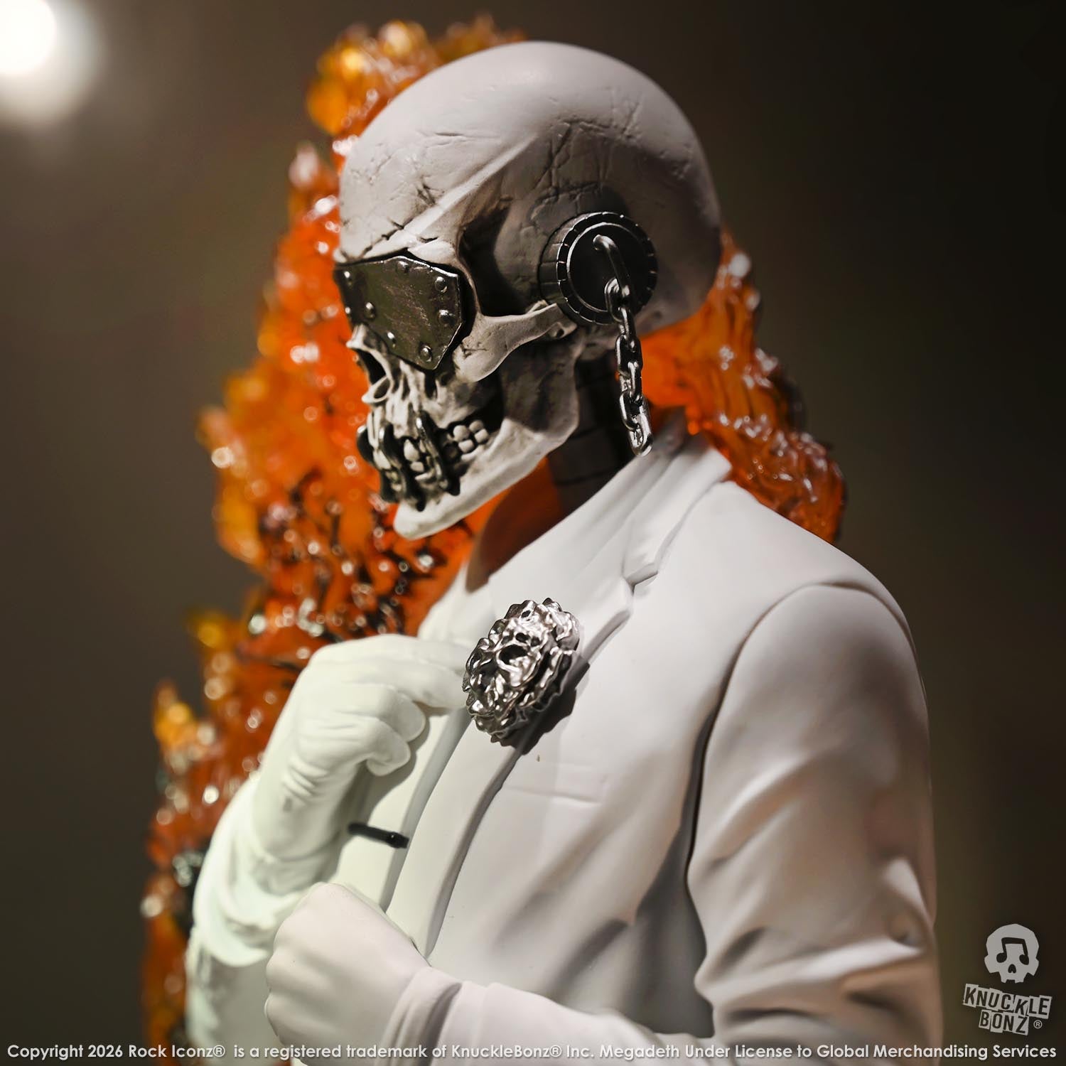 Limited edition statue of a skeleton in a white suit with red and orange flames. The statue s part of the 3D Vinyl KnuckleBonz collection.