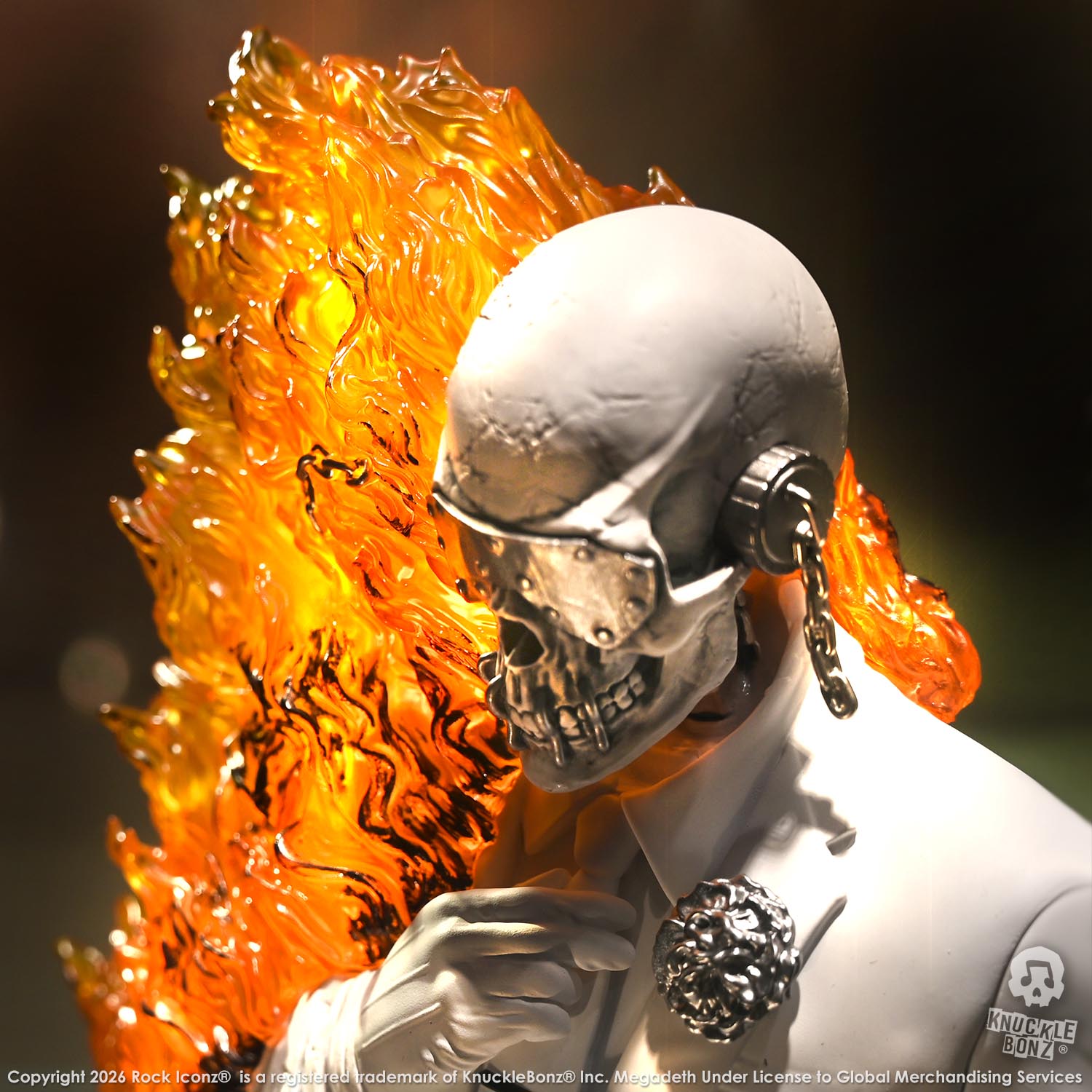 Limited edition statue of a skeleton in a white suit with red and orange flames. The statue s part of the 3D Vinyl KnuckleBonz collection.