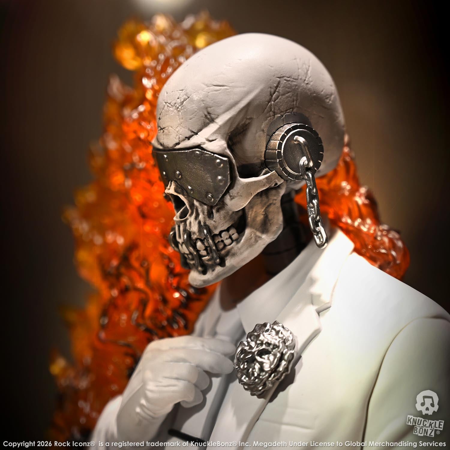 Limited edition statue of a skeleton in a white suit with red and orange flames. The statue s part of the 3D Vinyl KnuckleBonz collection.