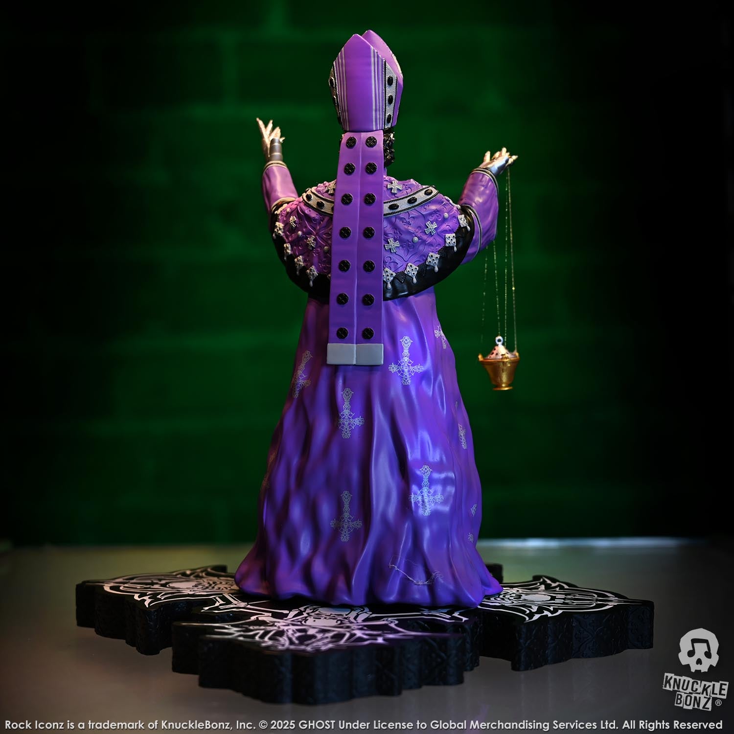 Statue of Papa V Perpetua from Ghost  in a purple robe with a green background
