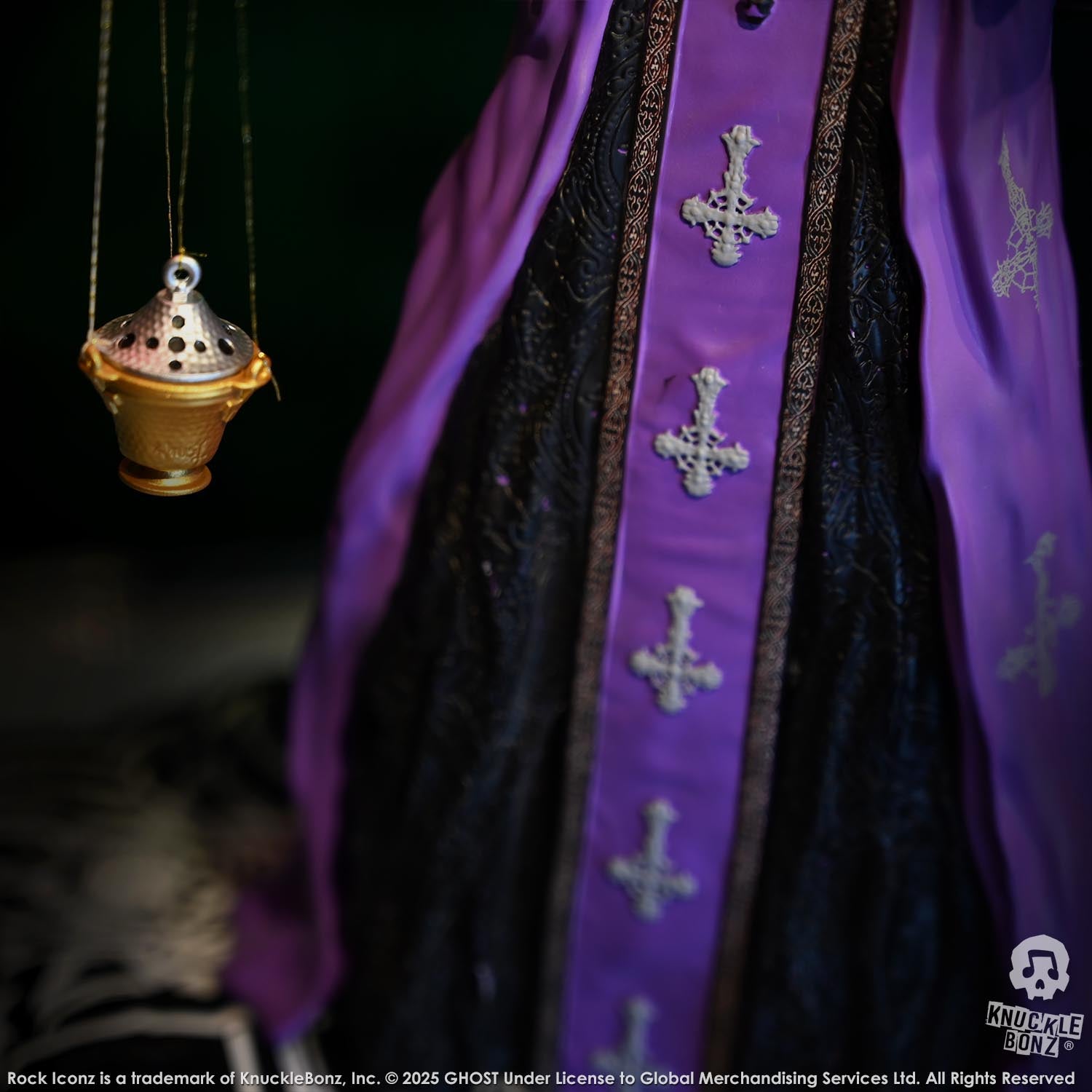 Purple robe with cross patterns and a hanging incense burner on a dark background