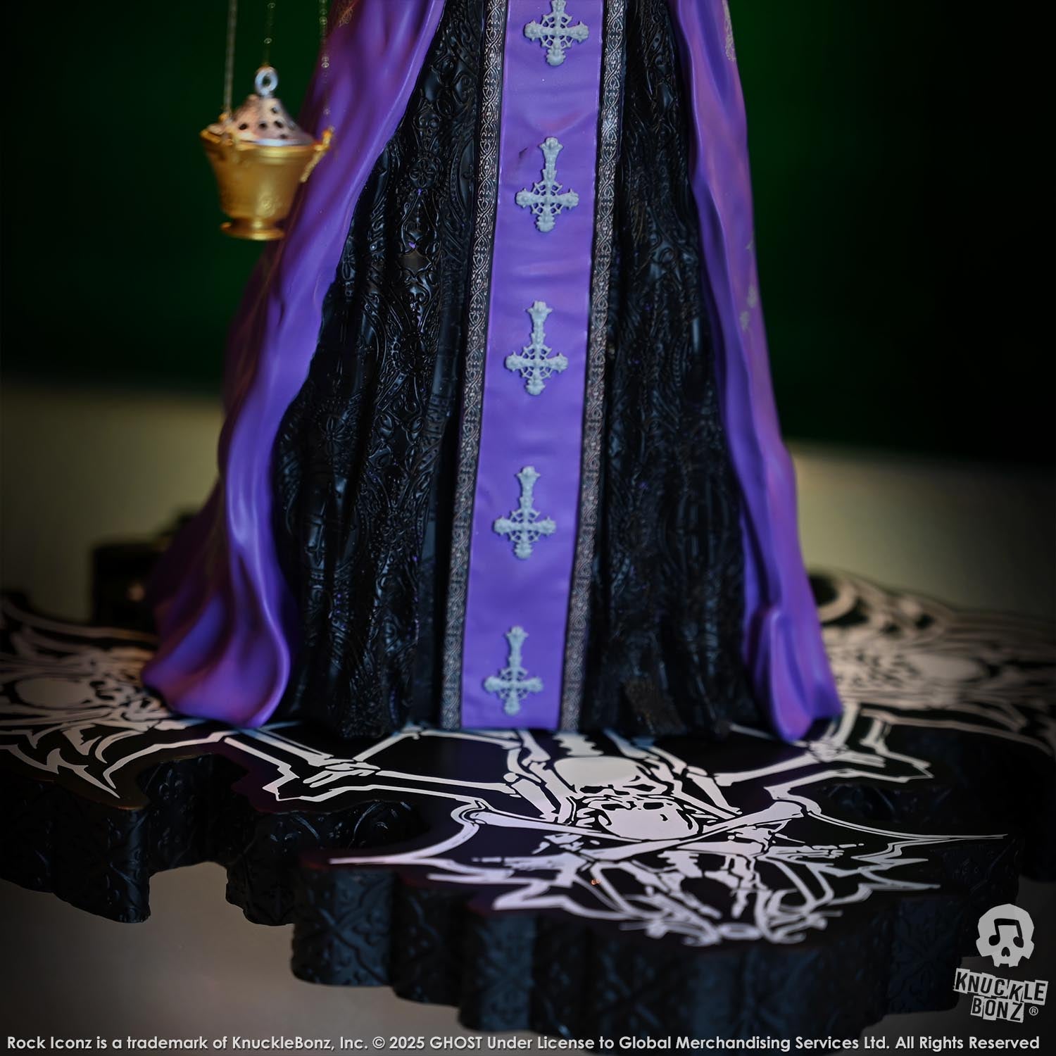 Statue of Papa V Perpetua from Ghost in a purple robe with a green background