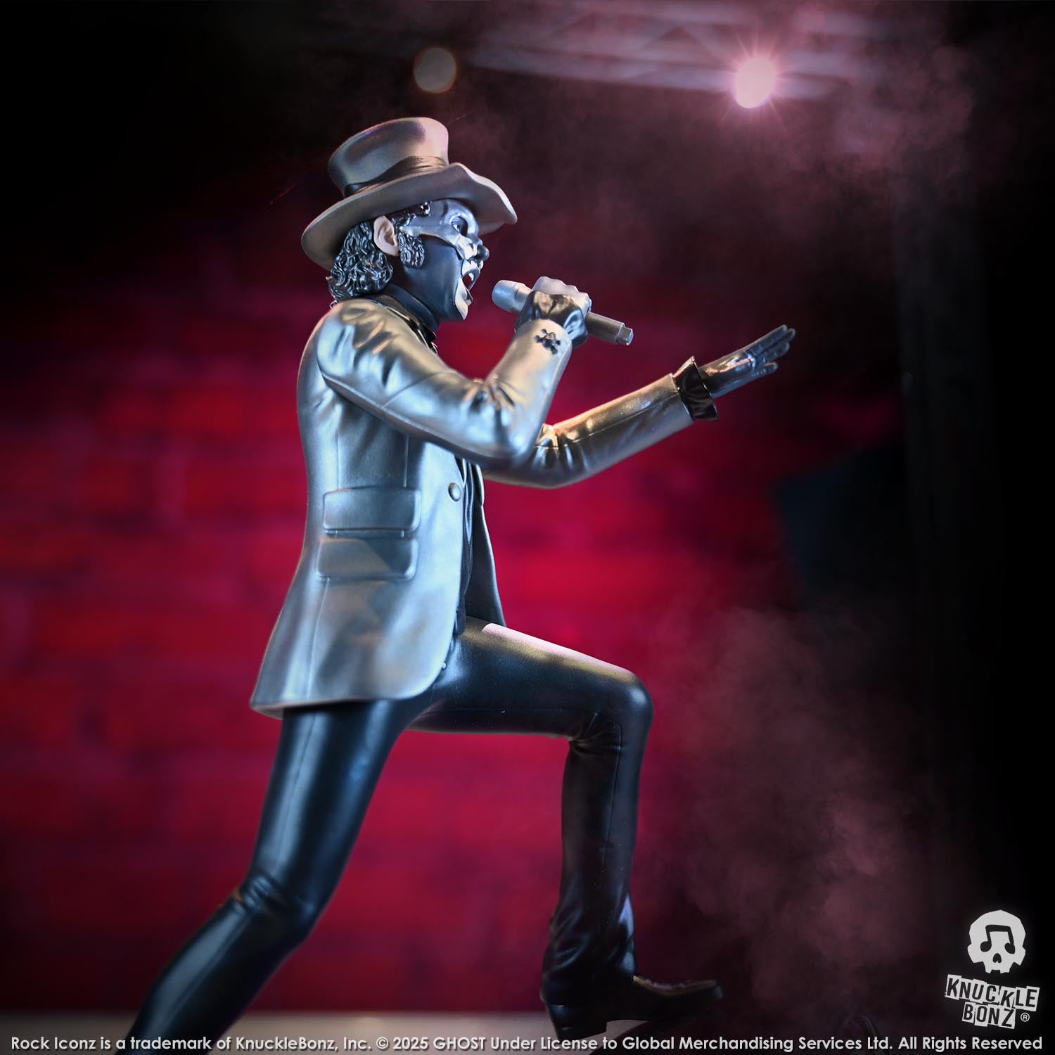 Statue of Papa V Perpetua from Ghost in a silver suit coat and top hat with a red background