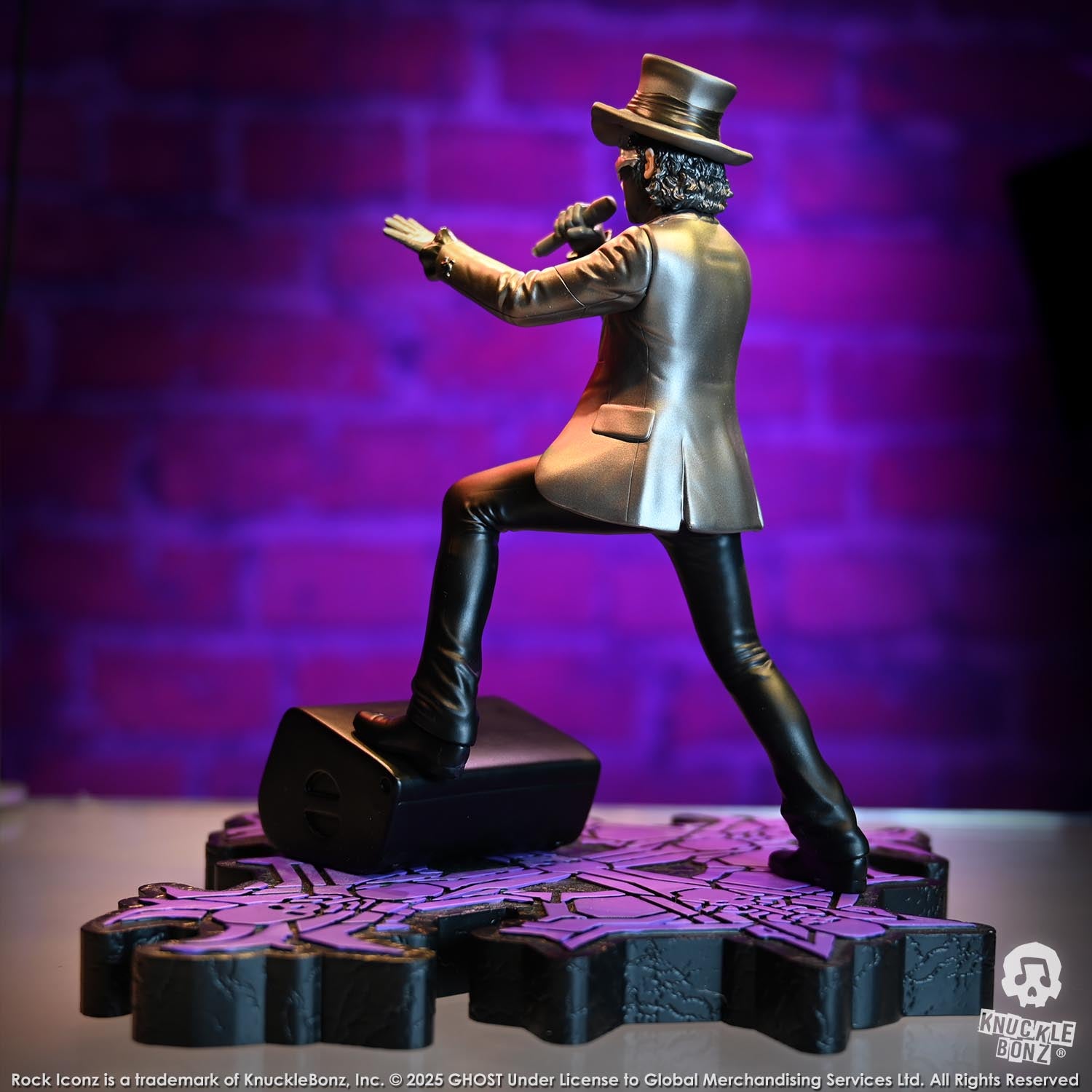 Statue of Papa V Perpetua from Ghost in a silver suit coat and top hat with a purple background